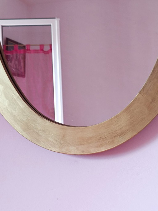 Oval mirror with gold frame