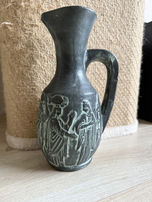 Vintage Greco-Roman style jug featuring relief figures