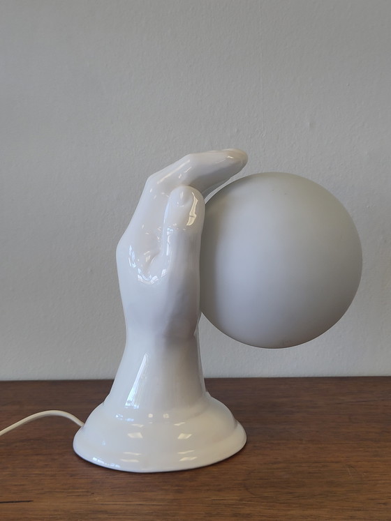 Image 1 of Lámpara de pared esférica de cerámica en la mano