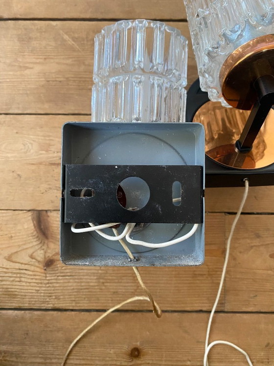 Image 1 of Een paar vintage koperen wandlampen van Phillips uit de jaren 70.