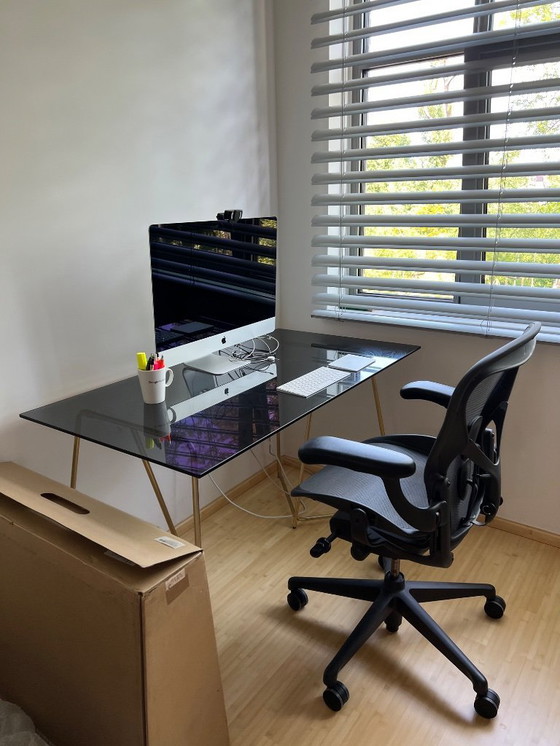 Image 1 of MADE  black smokey glass desk with golden metal legs