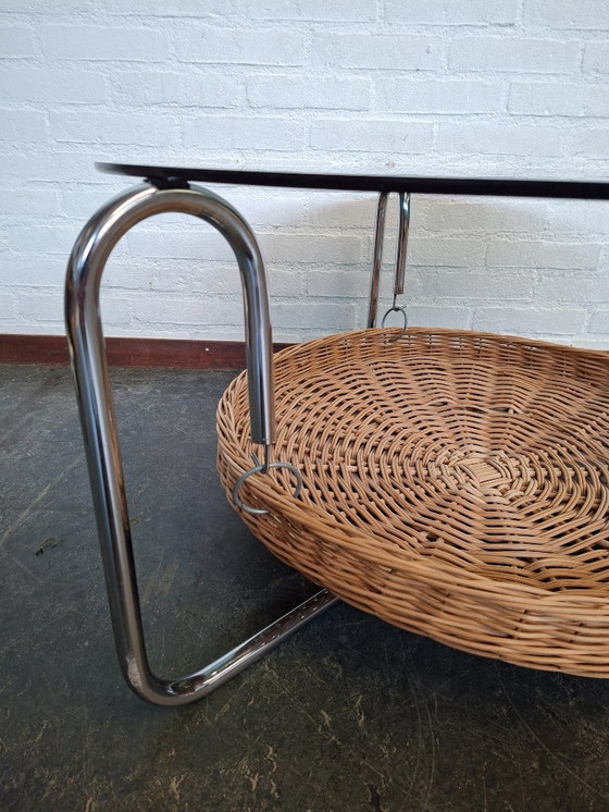 Image 1 of vintage round coffee table with glass top and wicker magazine basket