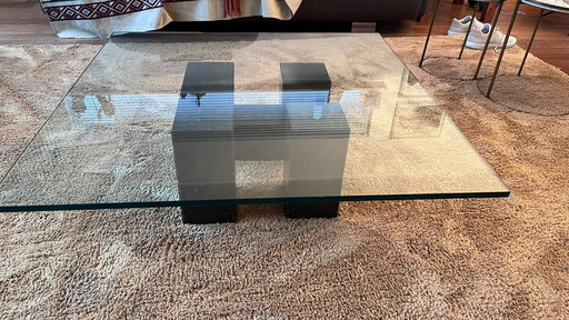 Glass coffee table with solid granite base