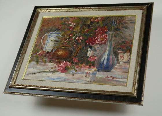 Image 1 of Still life with pink flowers and blue pots.