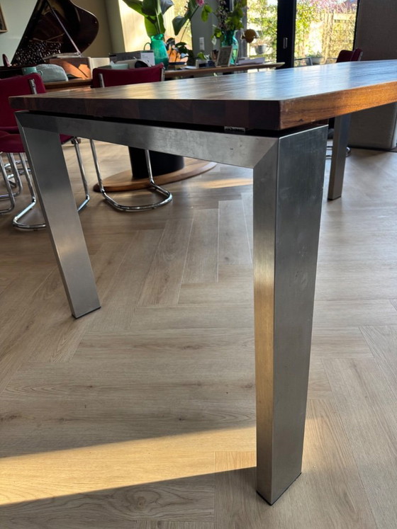 Image 1 of Walnut wood table with stainless steel legs