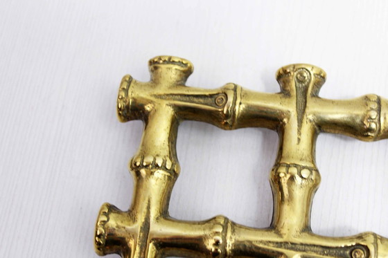 Image 1 of Onderzetter van imitatie bamboe en messing