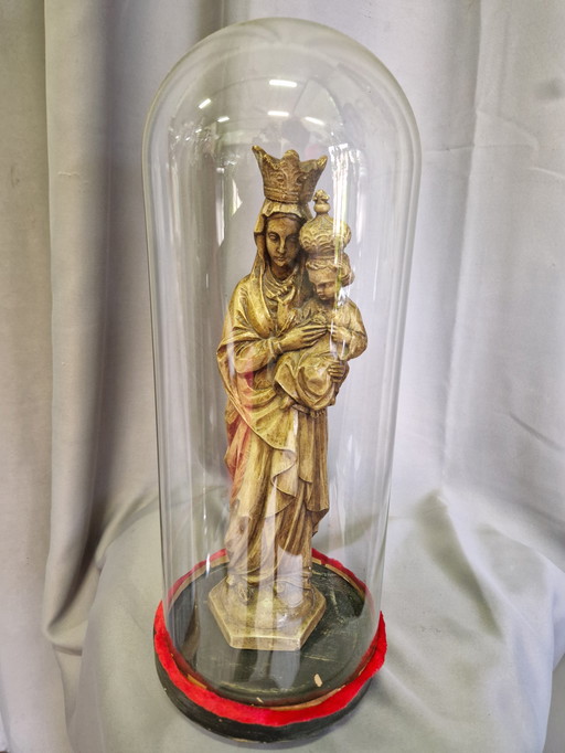 Religious statue under bell jar