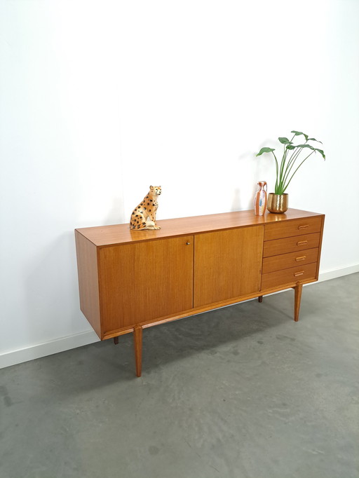 Sideboard with high legs and drawers