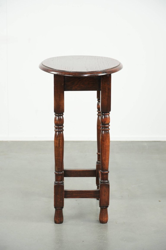 Image 1 of Antique oval English oak side table from the early 20th century with beautiful colors