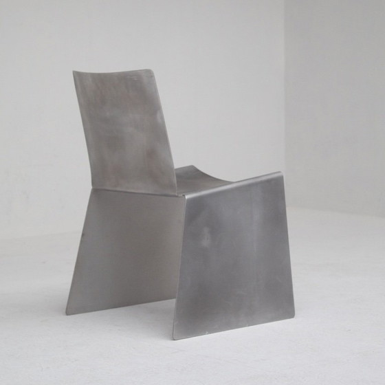 Image 1 of Metalen stoel en bijzettafelset van Xavier Lust