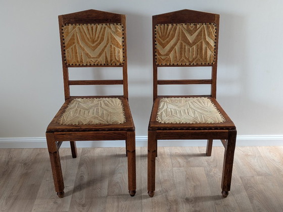 Image 1 of Een paar art-deco eetkamerstoelen van de Amsterdamse School – eikenhout en velours (jaren 1920/1930)