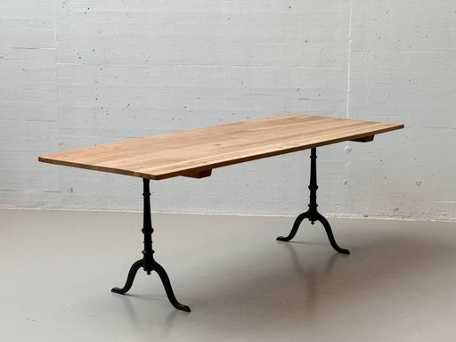 Classic cherry wood coffee table with cast iron legs by Horgenglarus