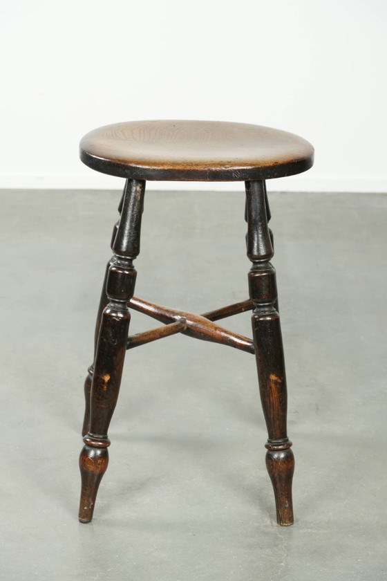 Image 1 of Antique English Windsor stool from the early 19th century with a unique oval shape