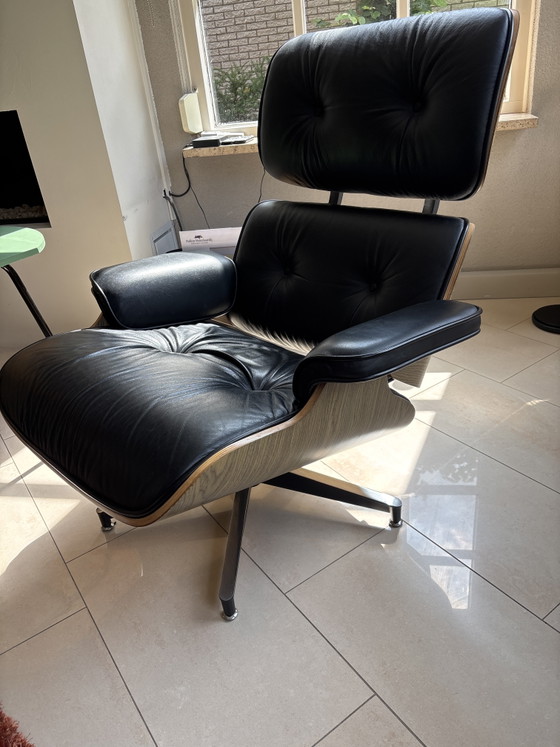 Image 1 of 2 x leather Eames armchairs with ottoman (replica)