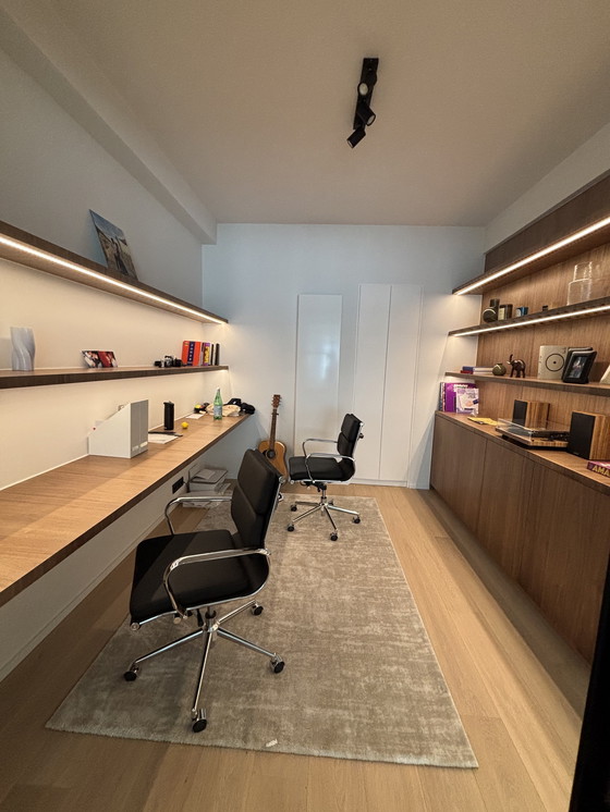 Image 1 of Eames black imitation leather office chair with castors.