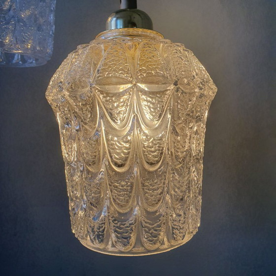 Image 1 of Set of two vintage Mic Century pendant lamps of thick, textured glass.