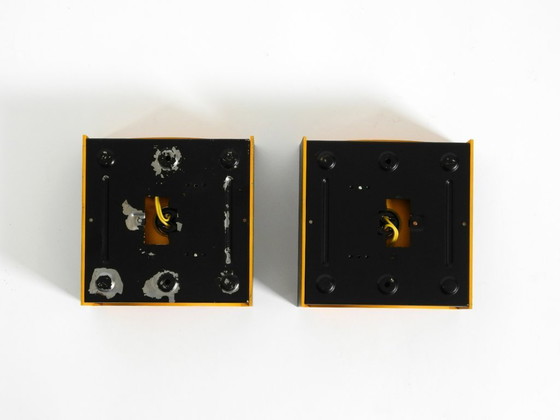 Image 1 of A rare pair of original 1960s Space Age metal wall lamps by Klaus Hempel for Kaiser Leuchten in yellow and black