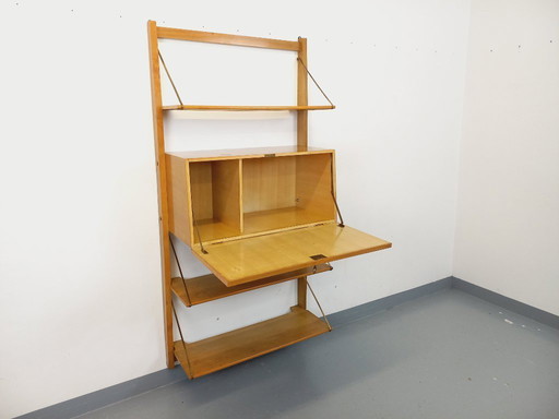 Wall-mounted bookcase with vintage light wood and brass secretary bar, dating from the 1960s