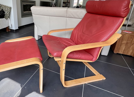Image 1 of Red leather armchair with footstool
