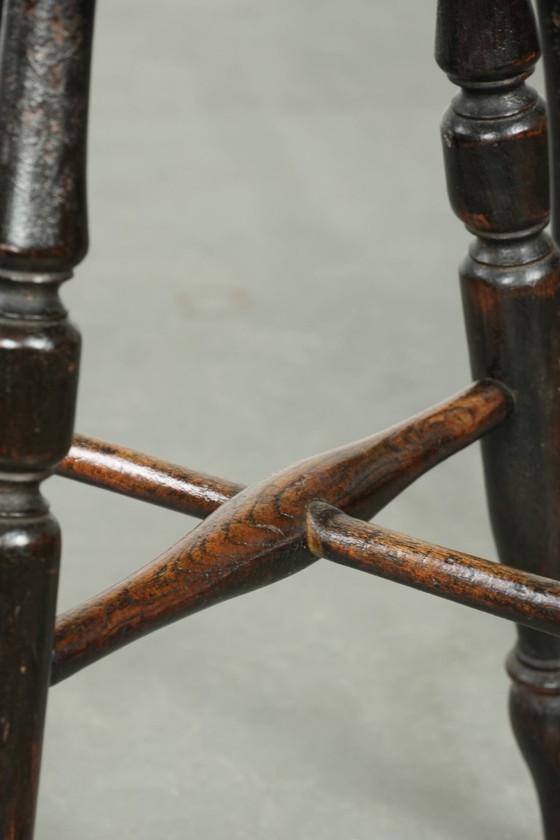Image 1 of Antique English Windsor stool from the early 19th century with a unique oval shape