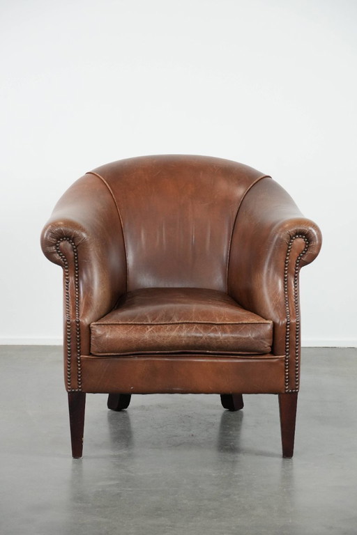 cognac-colored vintage cowhide club armchair in English style