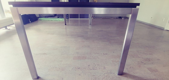 Image 1 of Design dining table with stainless steel frame with wooden top