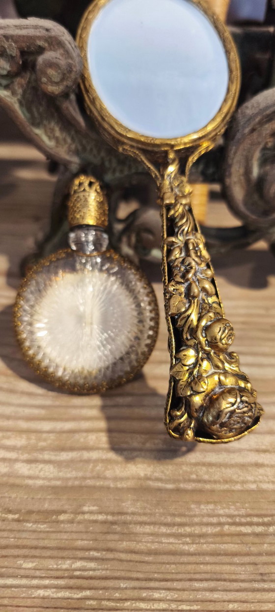 Image 1 of Vintage handspiegel en parfumflesje set.