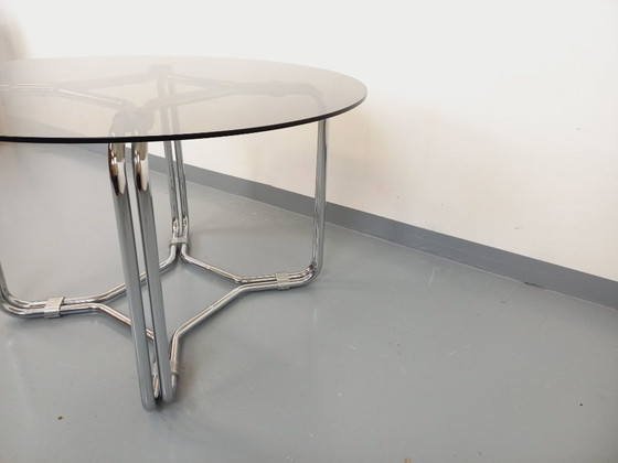 Image 1 of Round vintage dining table in smoked glass and chromed metal in the Space Age style of the 70s