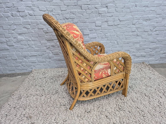 Image 1 of Luxurious Vintage Bamboo & Rattan Armchair with Floral Cushions – Warm Terracotta Tones