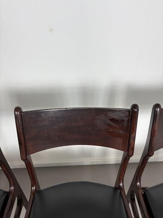 Image 1 of Set off 4 Vintage Palissander Wood With Black skai Leather dining chairs