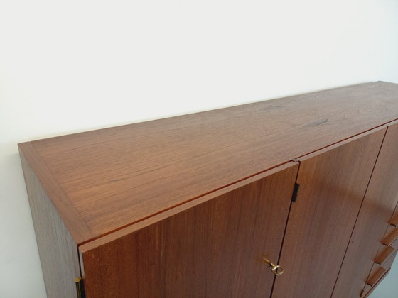 Image 1 of Tall, modernist, vintage Scandinavian sideboard in teak and black metal from the 1960s