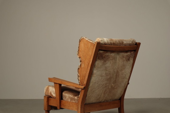 Brutalist oak lounge armchair and ottoman in original goat hide, 1960s – Wood (photo 2 of 15)