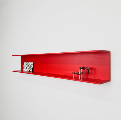 Red wall shelf by Walter Wirz for Wilhelm Renz