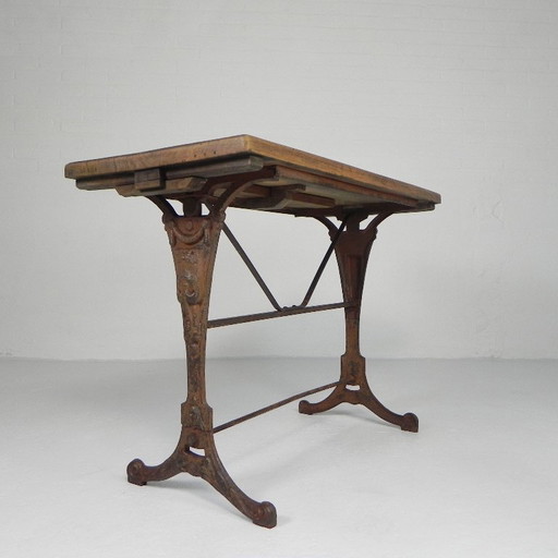 Art Deco bistro table with oak top on cast iron frame