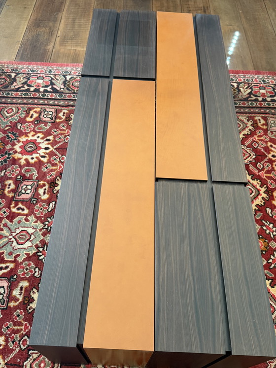 Image 1 of Custom-made, asymmetrical coffee tables (twin) of Macassar wood with orange calfskin details.