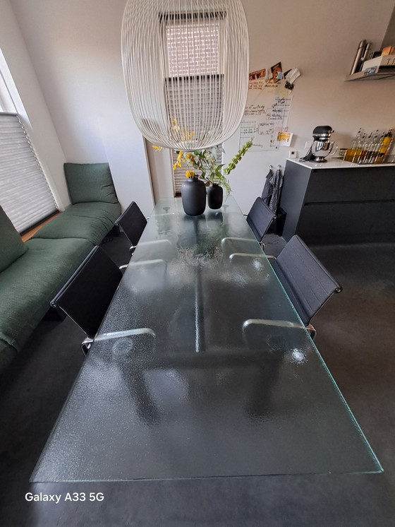 Image 1 of Beautiful combination of Cassina Le Corbusier table with frosted glass and 4 Vitra Eames chairs with black hupsakee upholstery 