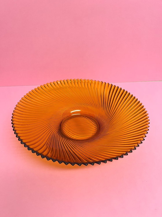 Image 1 of Vintage 70s swirl amber glass amber sunburst fruit bowl sawtooth edge orange