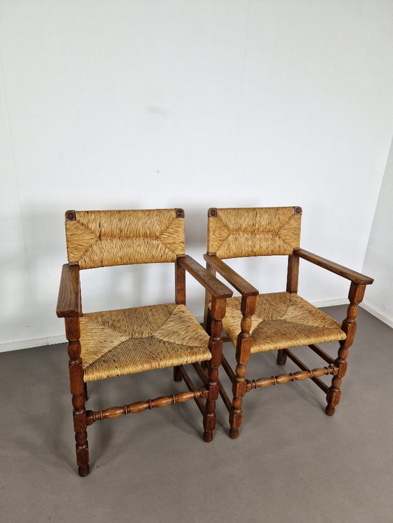 Image 1 of Vintage Franse Armleuningstoelen | Eiken en Riet