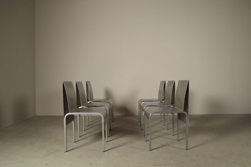 Set of six postmodernist stainless steel dining chairs from circa 1980-1990.