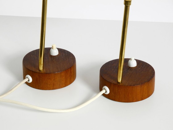 Image 1 of A pair of beautiful mid-century modern bedside lamps with perforated metal shades and teak wood bases