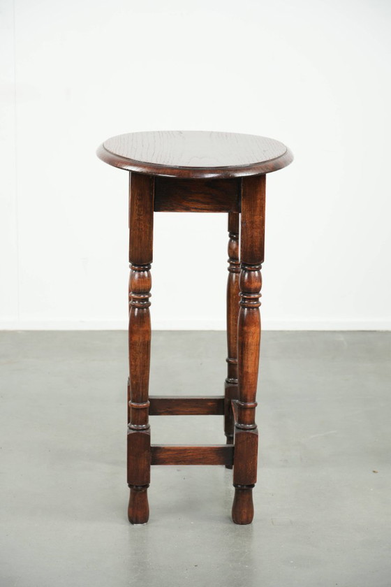 Image 1 of Antique oval English oak side table from the early 20th century with beautiful colors