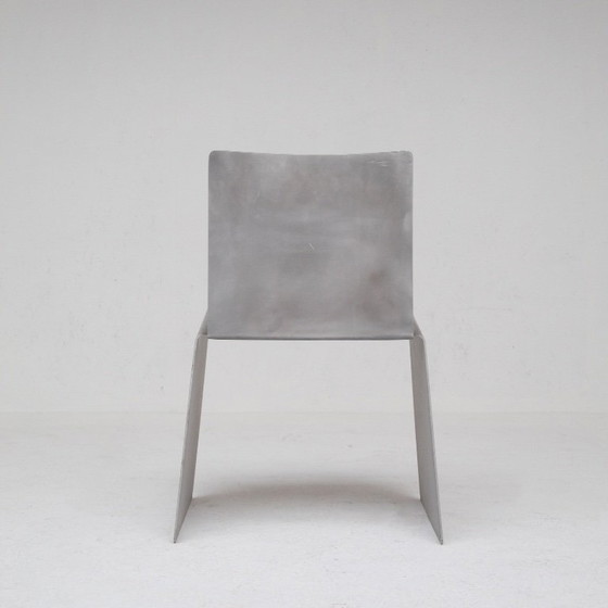 Image 1 of Metalen stoel en bijzettafelset van Xavier Lust