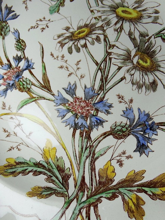 Image 1 of Antique Longchamp deep dish with polychrome ironstone daisies
