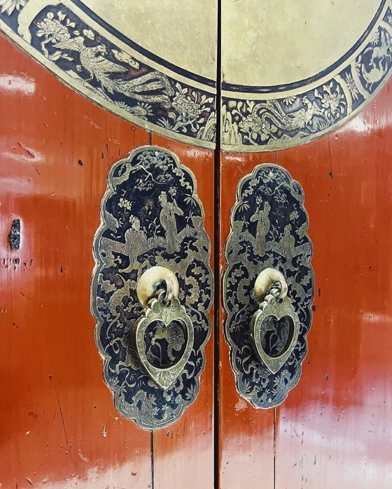Image 1 of Antique red cabinet with brass details