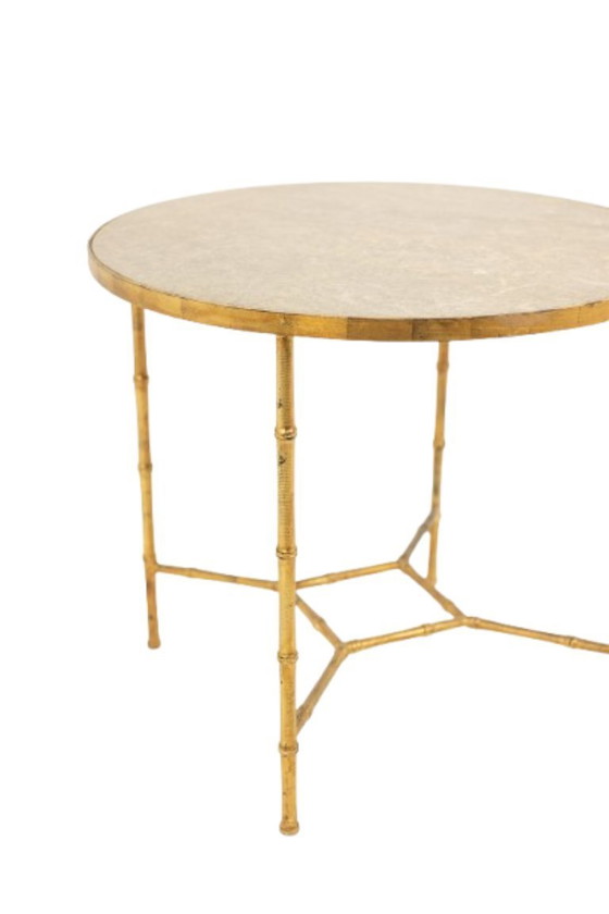 Image 1 of Pedestal table. Gilt metal base and grey marble top. 20th century.