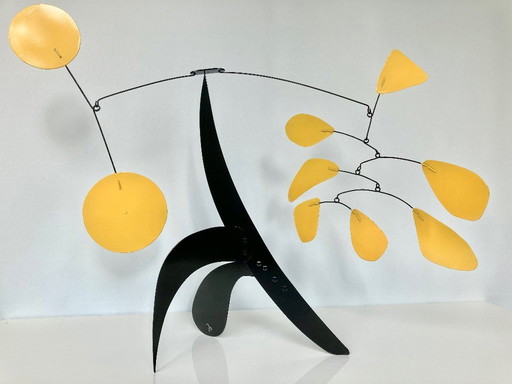 Black stabile with 9 yellow discs and leaves