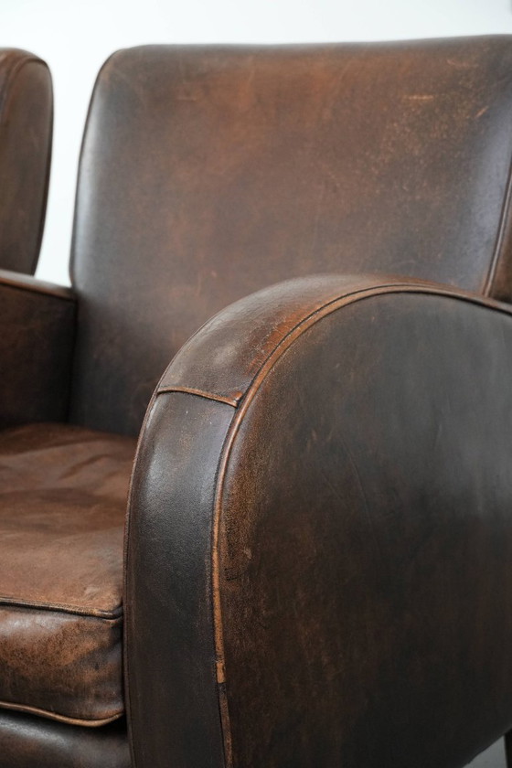 Image 1 of 2 x Vintage schapenleren design fauteuil in een donkere cognac kleur
