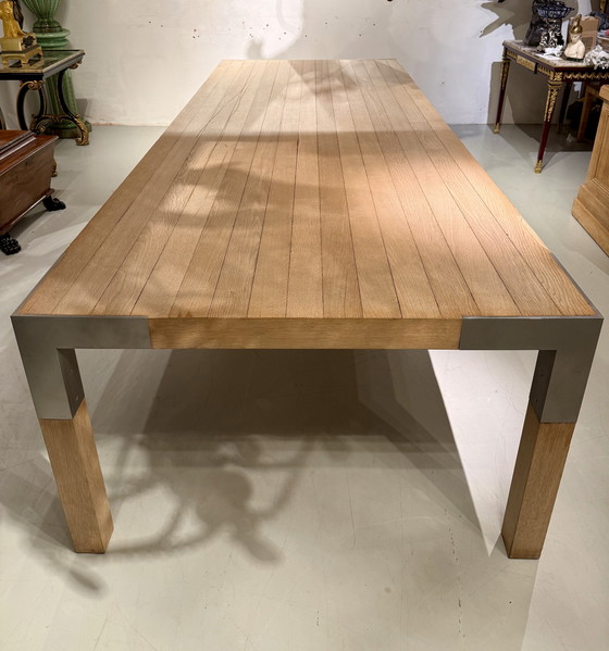 Image 1 of A large oak dining table, designed by Claire Bataille and Paul Ibens