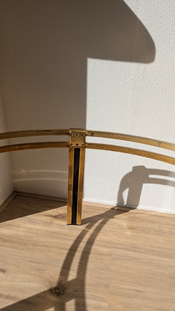 Image 1 of Hollywood Regency salontafel van zwart messing en gerookt glas
