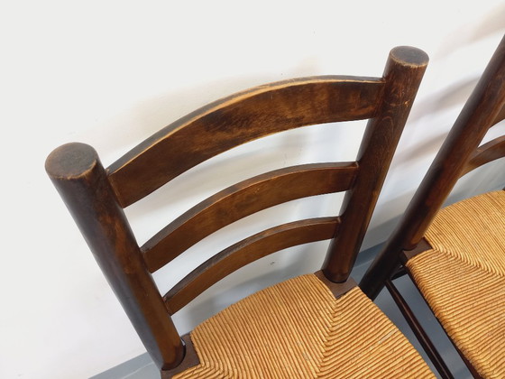 Image 1 of Set van 6 vintage brutalistische stoelen van Georges Robert, gemaakt van hout en stro, uit de jaren 50 en 60.